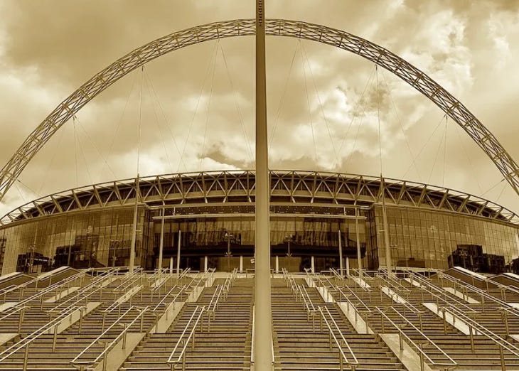 A sepia photo of Wembley Stadium