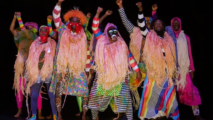 People dressed in colourful Nigerian costumes