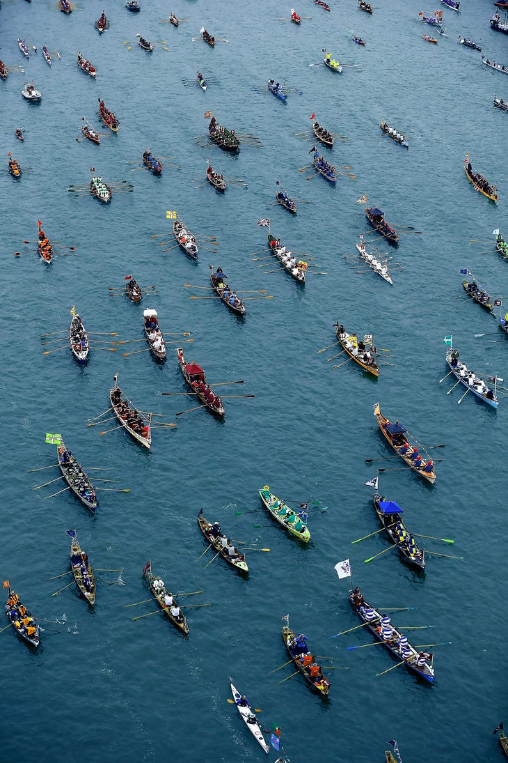 Aerial shot of loads of rowing boats on the Thames