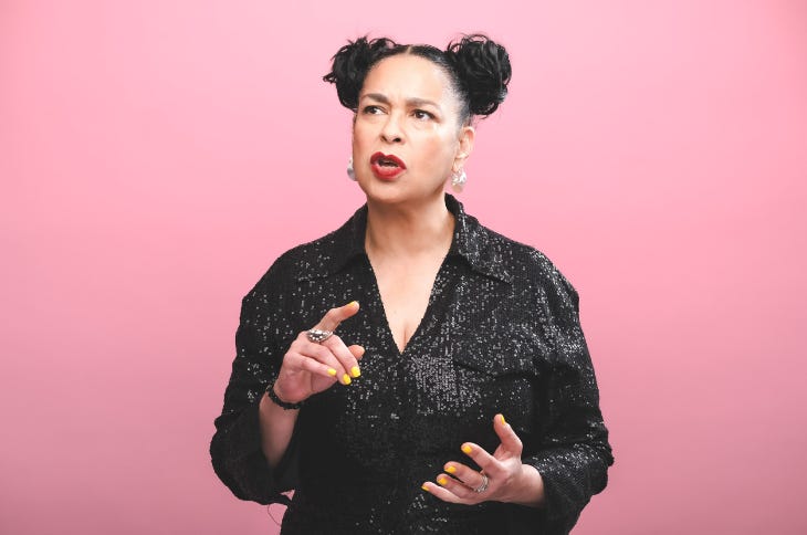 Josephine Lacey talking, wearing a black blouse.