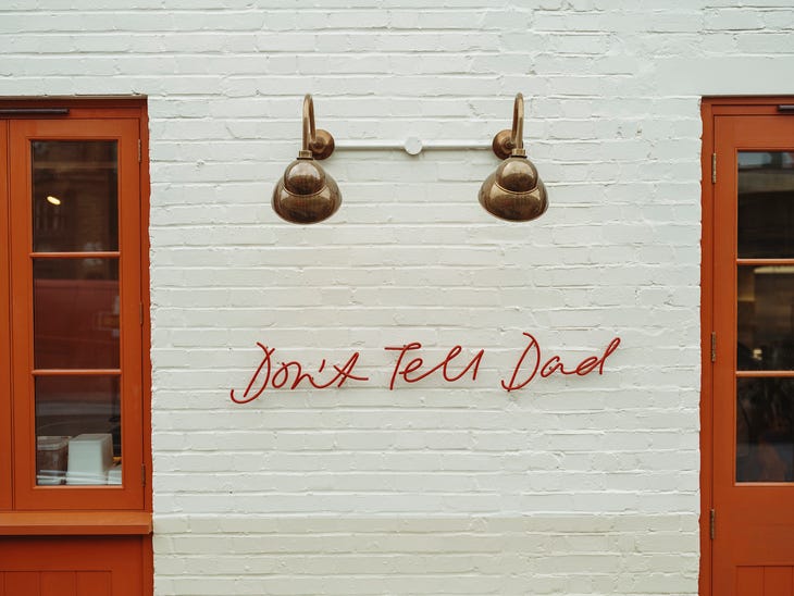 The front of a restaurant: Don't Tell Dad