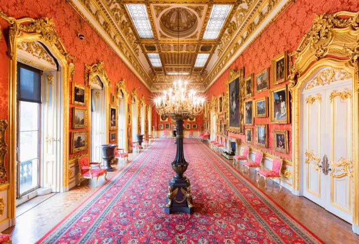 Opulent interior of a palace with gold gilding and a chandelier