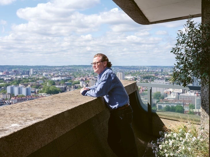 Robert Elm looking out over London from a Barbican balcony