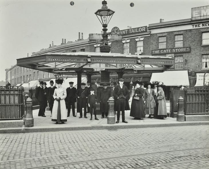 Old photo of people waiting at a tram stop