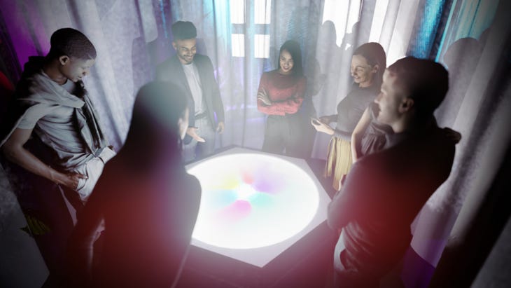 People standing around a glowing table