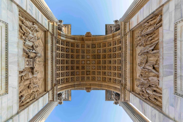 Looking up at an impressive archway