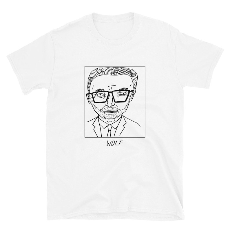 May include: A white t-shirt with a black line drawing of a man wearing glasses and a suit. The text 'WOLF' is below the drawing.