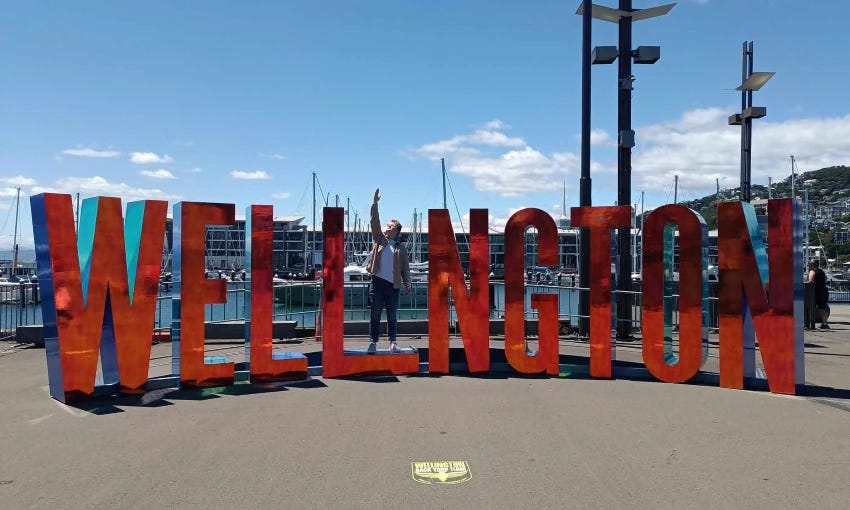 Joel MacManus in the Well_ngton sign.    