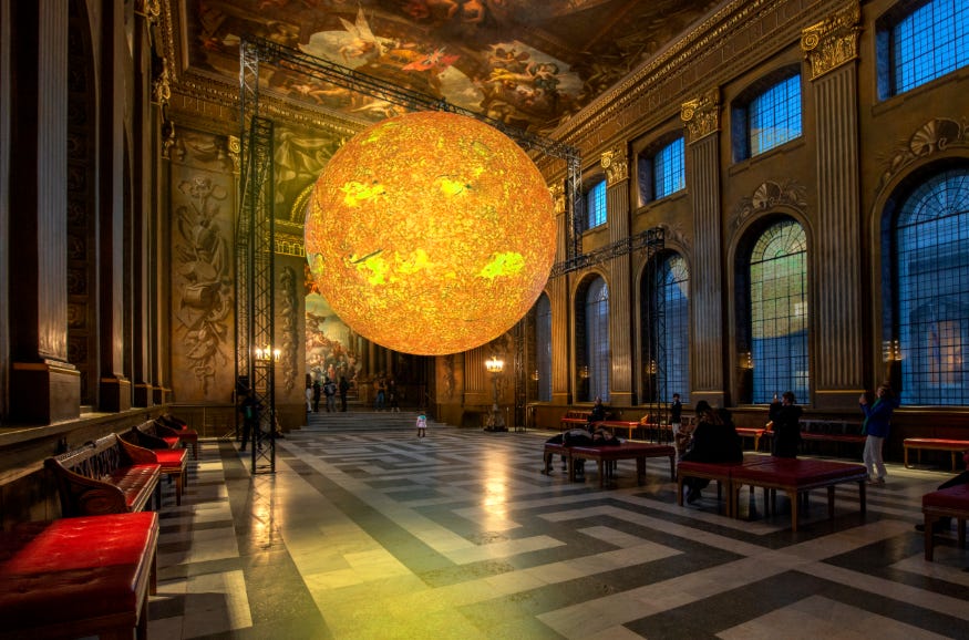 A glowing model of the sun on display in the Painted Hall