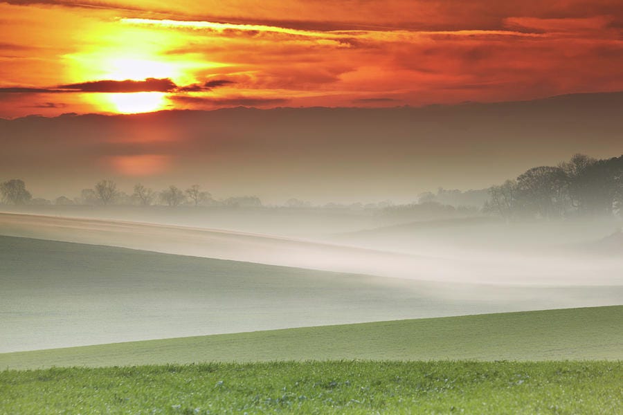 Mist Over Landscape Of Rolling Hills Photograph by Andy Freer