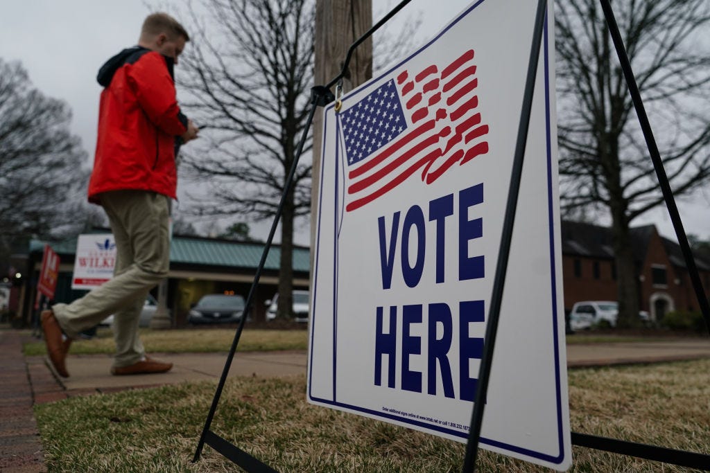 A man approaches a polling place on Election Day.