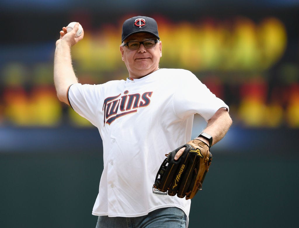 Minnesota Gov. Tim Walz throws out the first pitch at a Twins game.