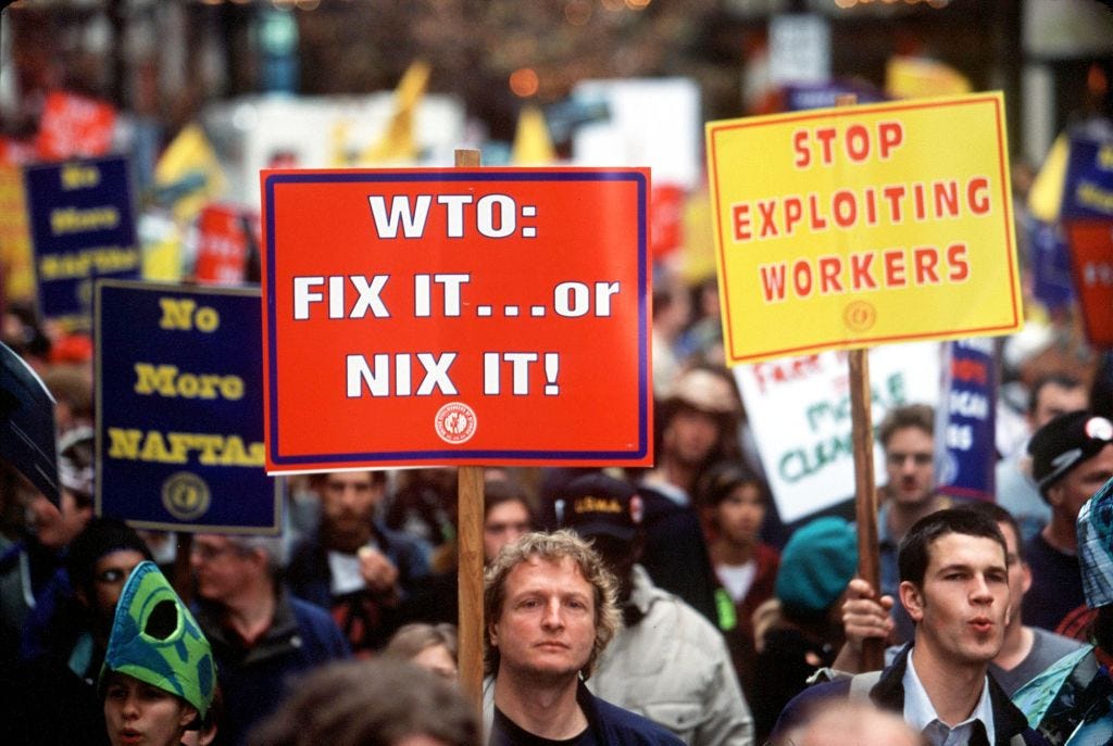 A WTO protest takes place in Seattle in 1999.