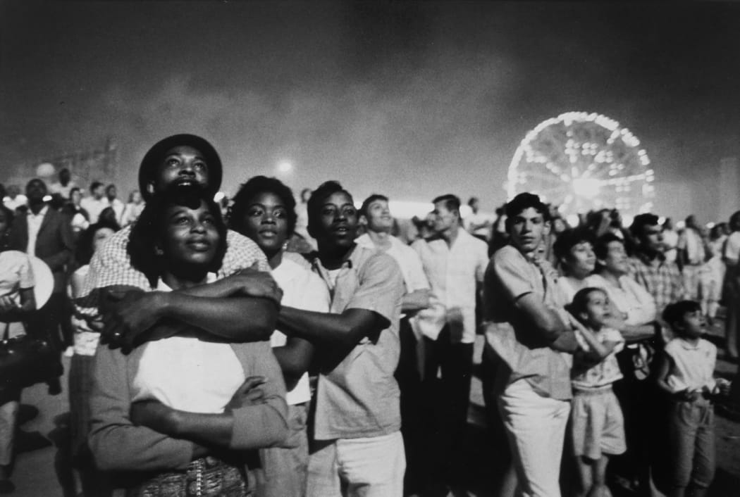 Photo by Matt Ruby on July 06, 2024. May be a black-and-white image of 5 people, people standing, crowd and text.