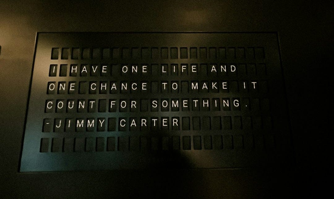 A sign on a wall that says i have one life and one chance to make