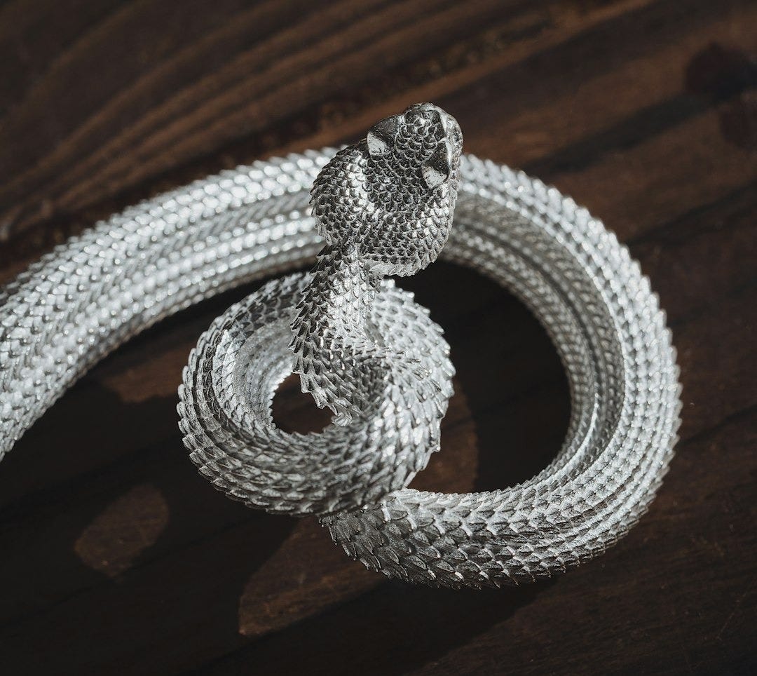 a close up of a rope on a wooden surface