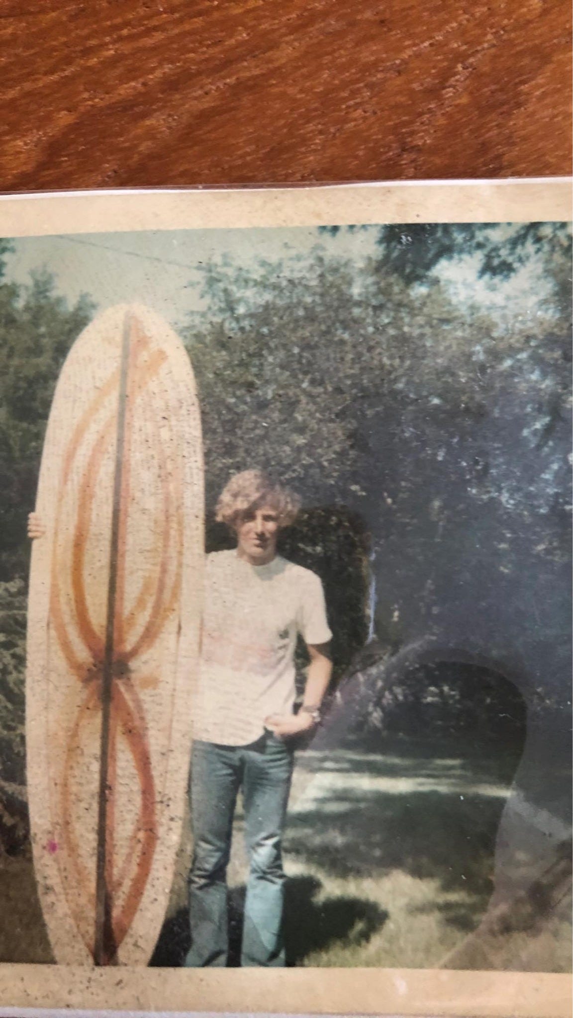 May be an image of 1 person, skateboard and surfboard