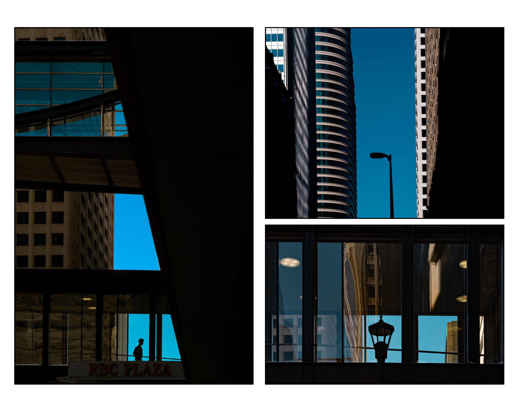 A silhouetted person and street lights are framed by buildings and skyways in downtown Minneapolis on a sunny, blue sky day.
