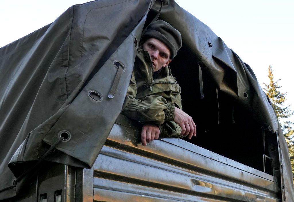 Russian army recruit on the back of a truck