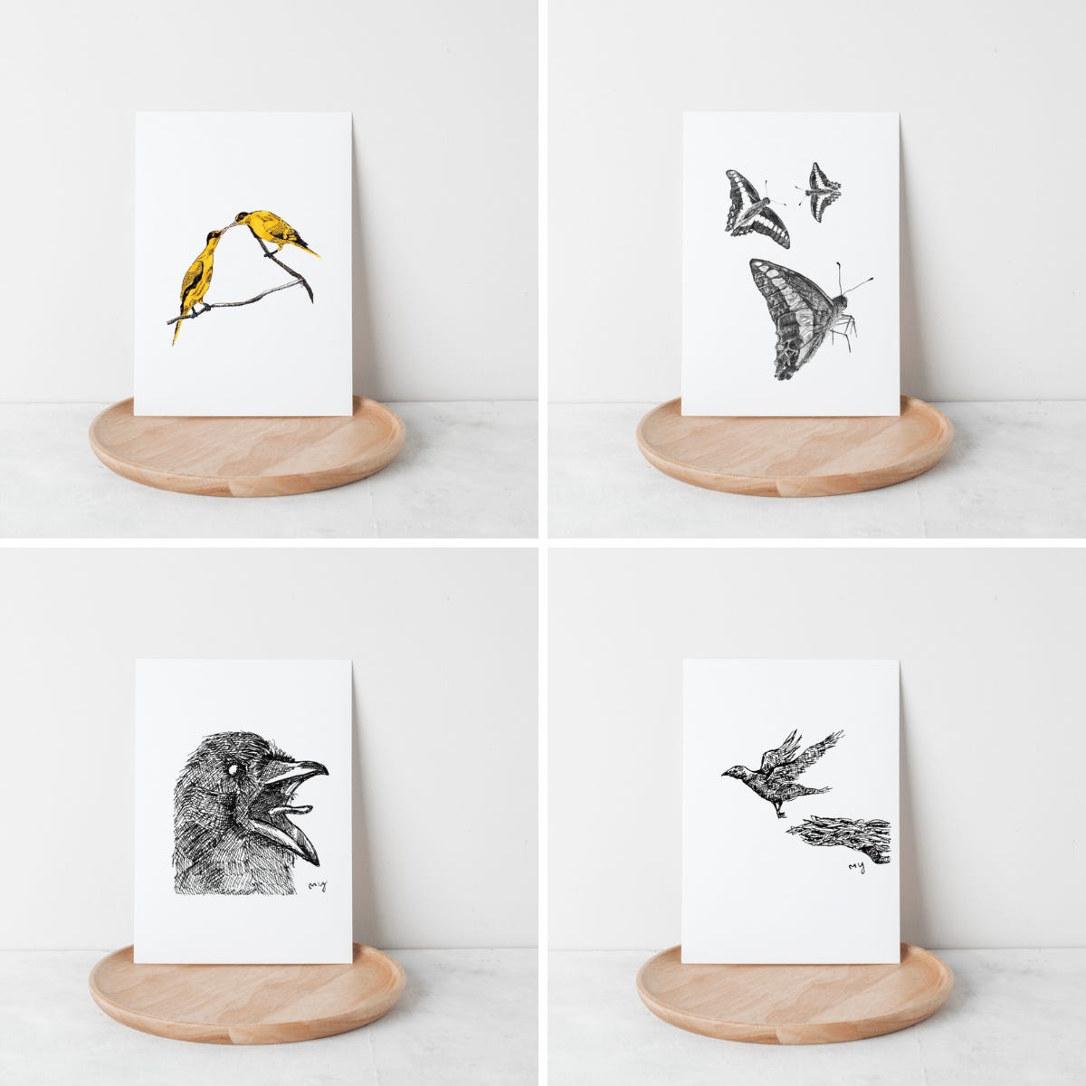 image: set of four mini art prints display with line drawings of a pair of yellow oriole birds, butterflies stipple drawing, raven and a flying bird