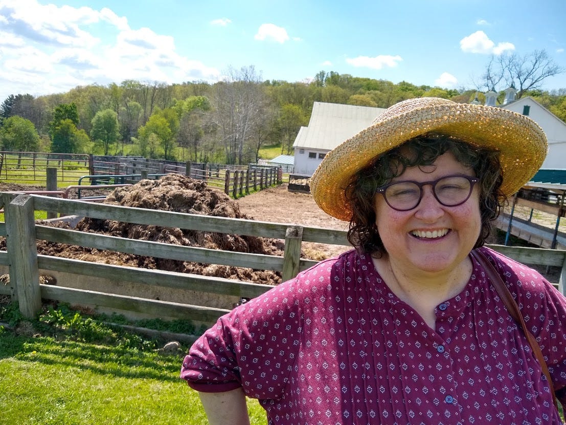 Annette on farm with poop pile