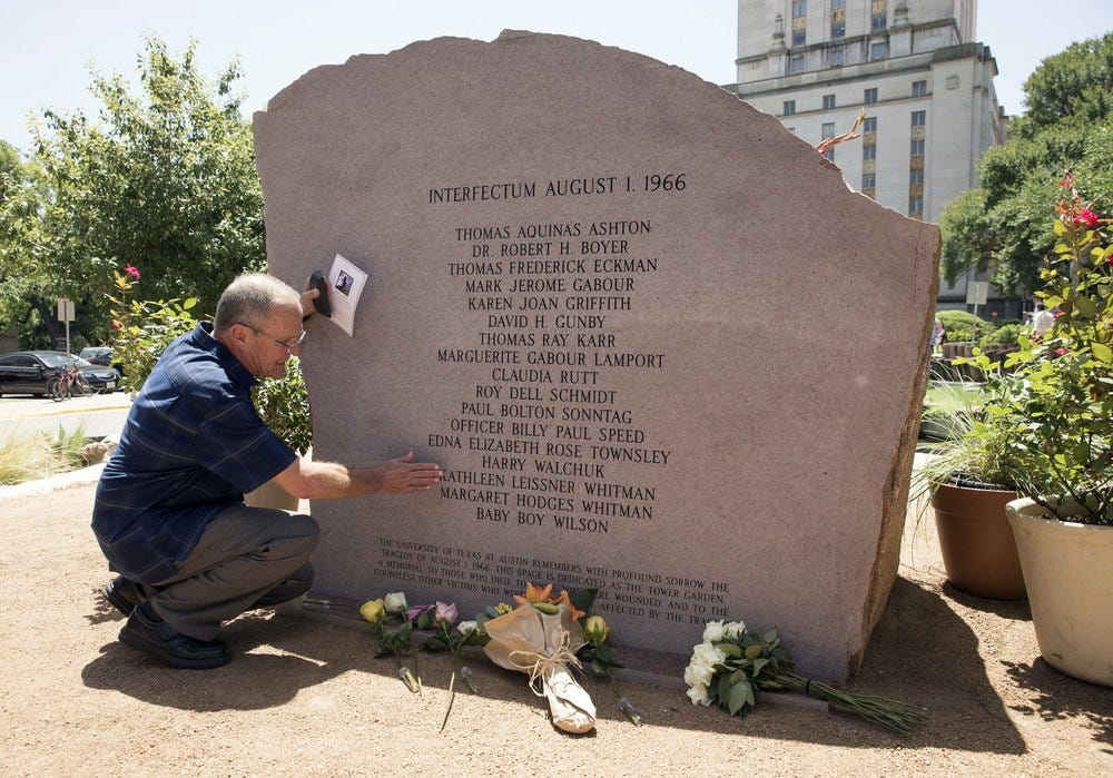 FILE - In this Aug. 1, 2016, file photo, Nelson Leissner pauses in memory of his sister, Kathleen Leissner Whitman, at the memorial during the 50th anniversary remembrance of the University of Texas at Austin tower shootings, at the school in Austin, Texas. The incorrect form of a Latin word has been replaced on the granite memorial for victims of the 1966 shooting. The Austin American-Statesman reports that names of the 17 people slain were etched on the monument below the Latin word "Interfectum," equivalent to the English word "killed," which UT classics professors say was grammatically incorrect and negative in tone. (Jay Janner/Austin American-Statesman via AP, File)