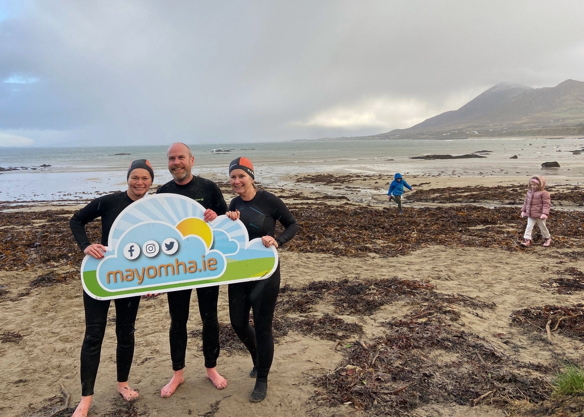Photograph of Oliver Moran taking part in a St Stephen’s Day swim with family in County Mayo in aid of the Mayo Mental Health Association.