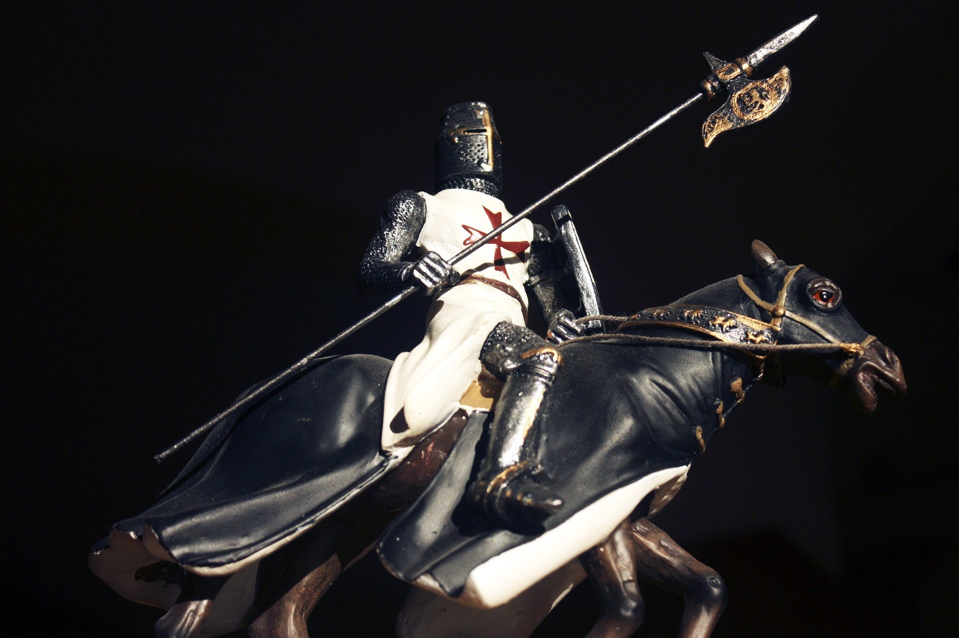 A crusader on a horse armed for battle.