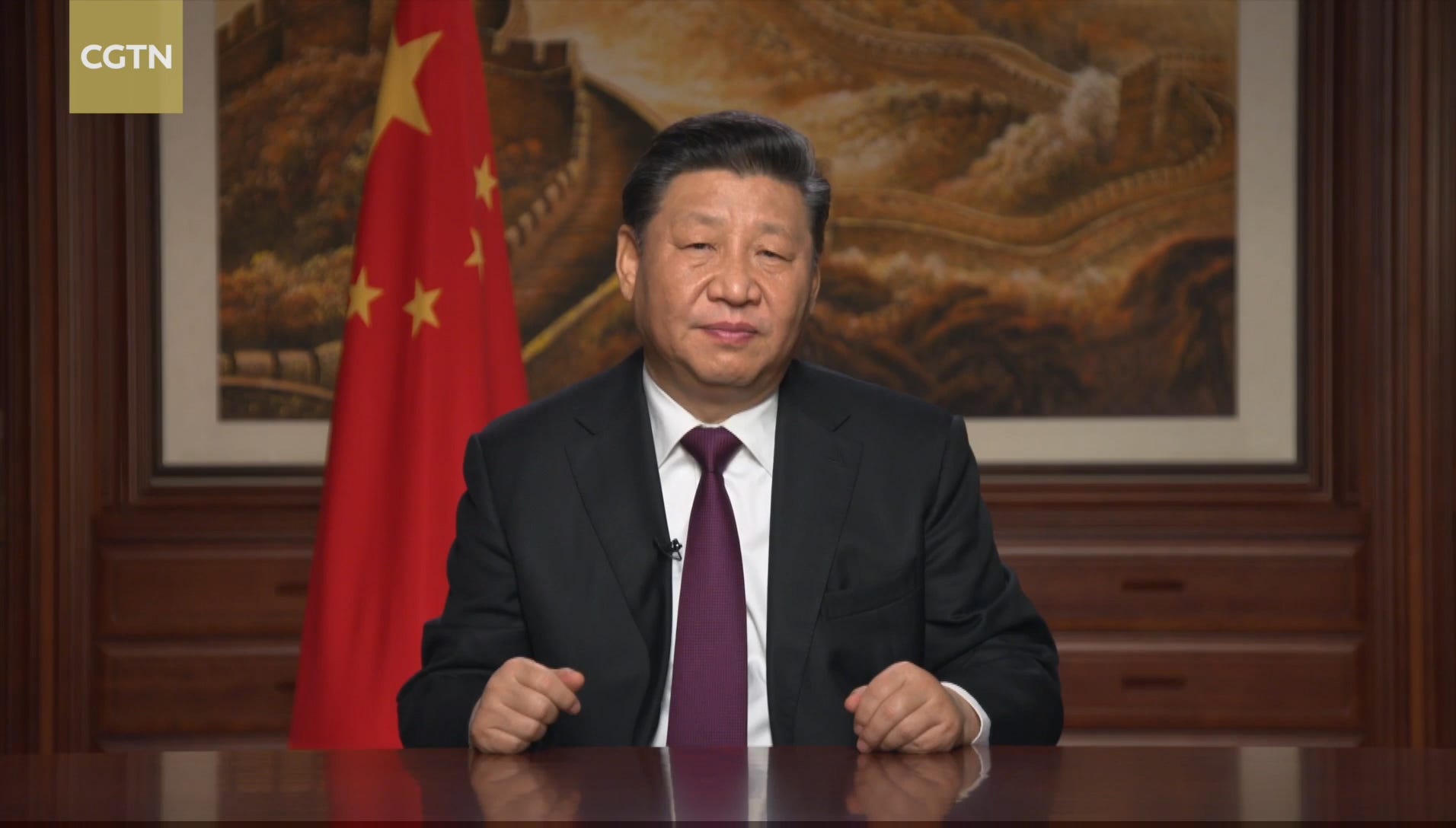 A picture of China president Xi Jingping sitting at a desk during the Chinese New Year in 2019.