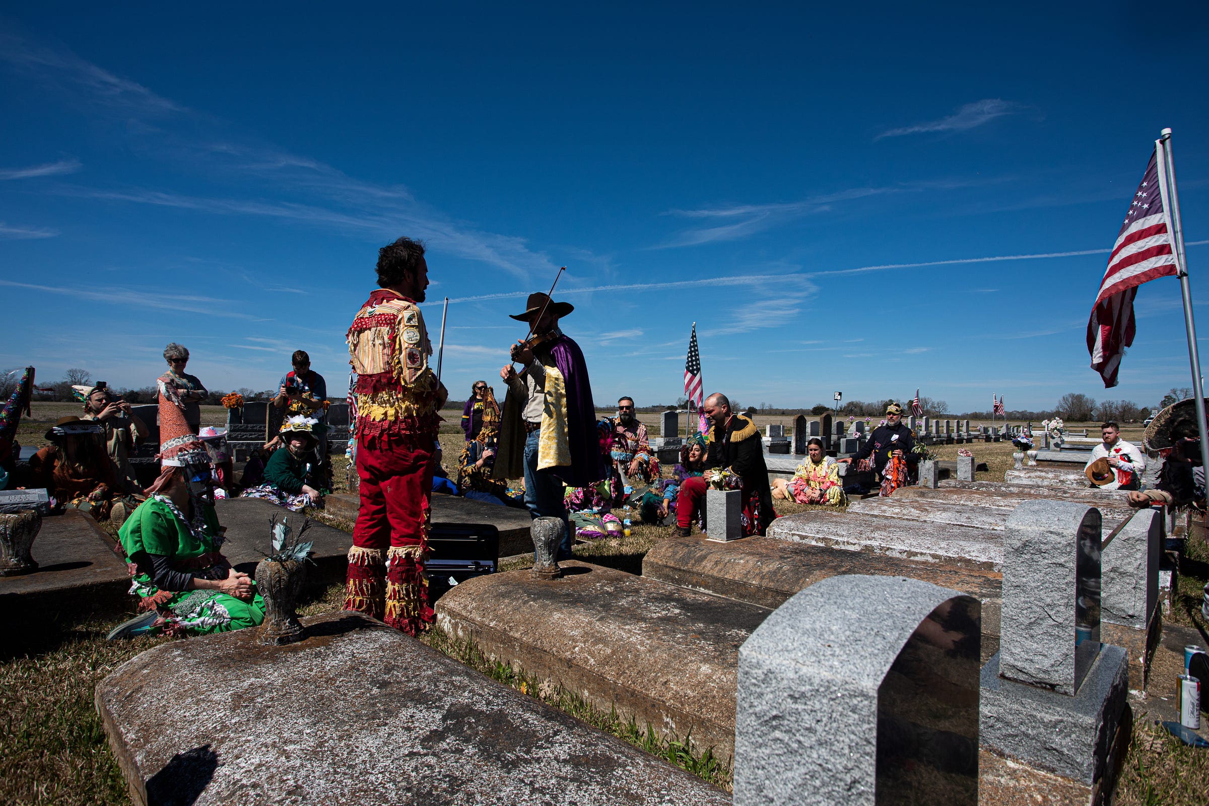 Joel, left, and Jourdan, right, serenade the dead.