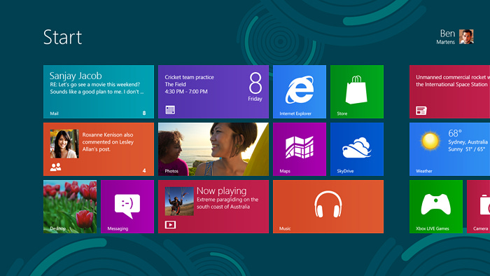 The Windows 8 start screen showing the default configuration. There are several application tiles and some of them are showing additional live content.
