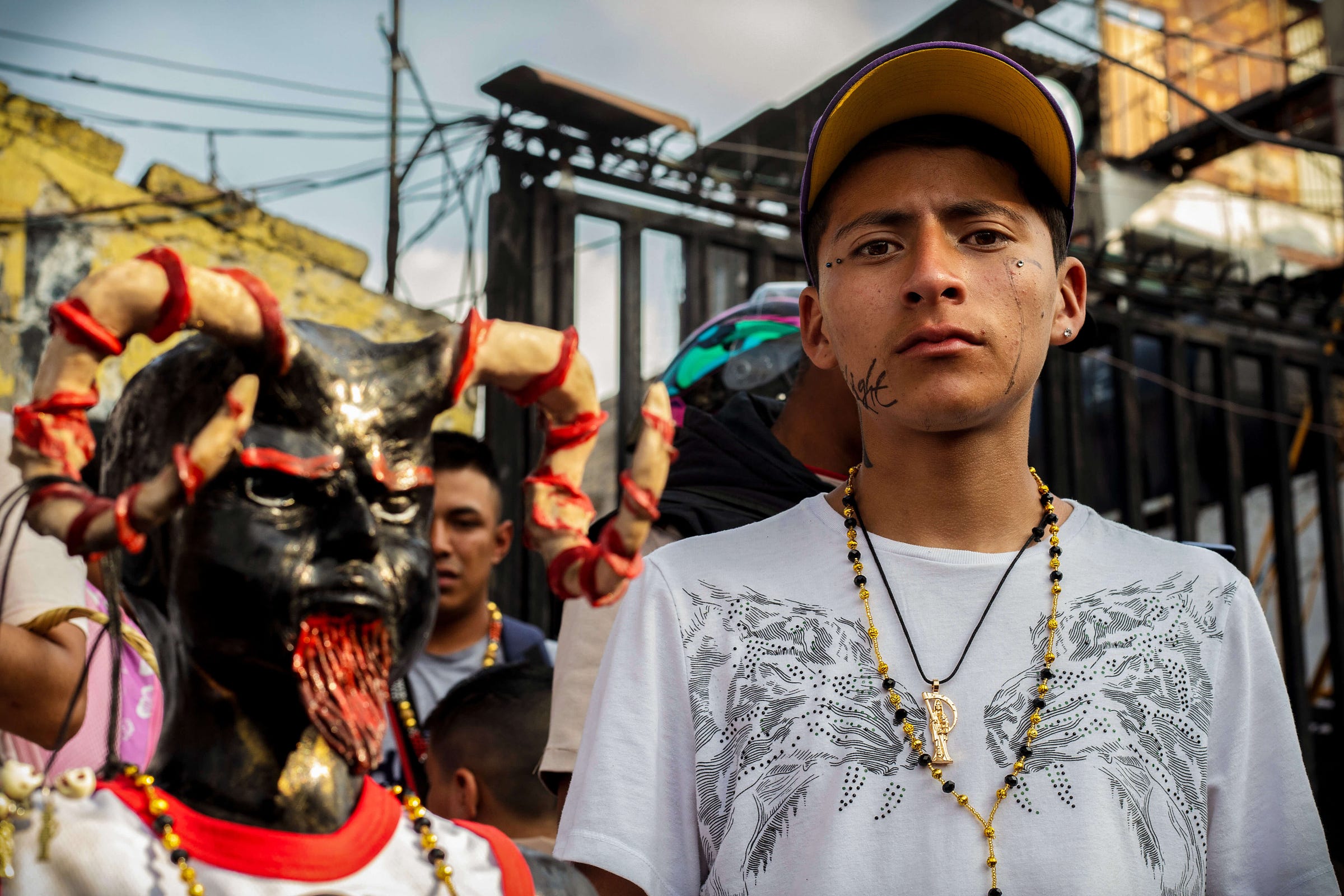 santa muerte devotee in tepito, ciudad de mexico. with a gangster look