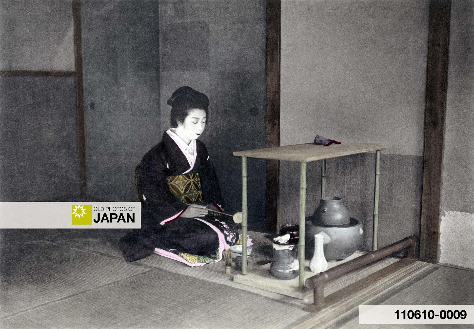 Japanese woman prepares tea during a tea ceremony