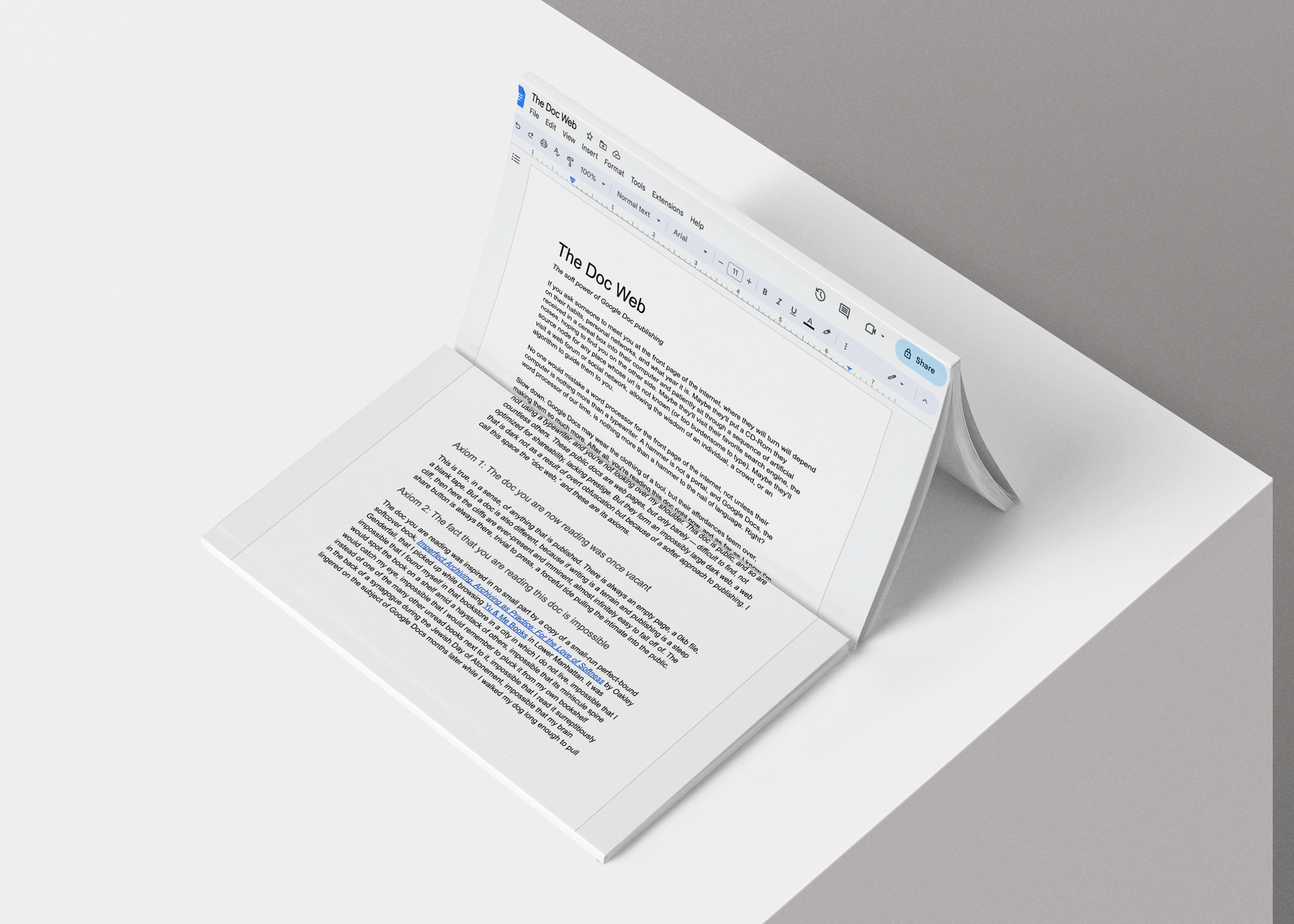 A screenshot of a Google Doc printed onto a softcover book open on a grey background