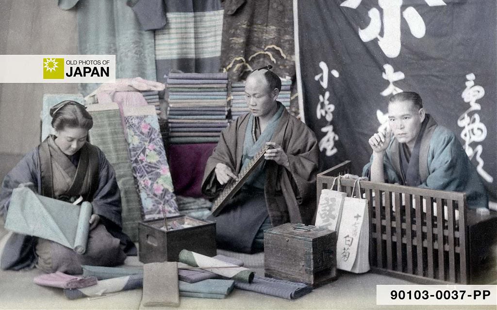 1890s studio photo of a Japanese kimono shop with a hibachi 1890s studio photo of a Japanese kimono shop with a hibachi