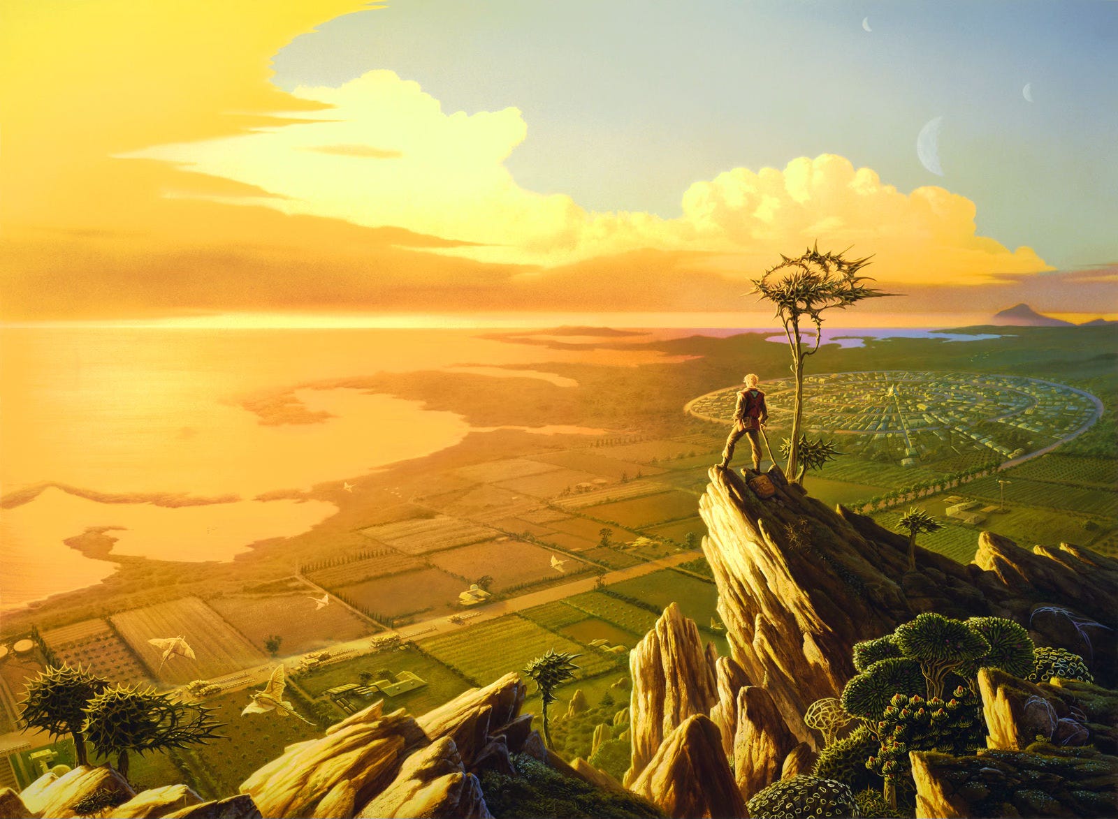 A man stands on a rock outcrop overlooking a long road that leads through farmland and into a spiral that winds through a densely packed settlement. The tree growing out of the rock overlook has a spiky top. More foliage in the right foreground provides hints that this is an alien world. Three crescent moons hang in the sky. On the far left, the painting is oversaturated with a golden glow that sits over the water of a nearby bay and gradually blends into verdant green surrounding the spiral city. Winged creatures, much like aquatic rays, glide low over the fields and road.