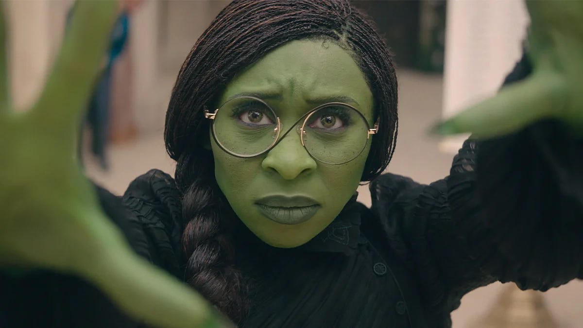 Cynthia Erivo as Elphaba Thropp faces the camera with a determined look on her face in a still from the film Wicked