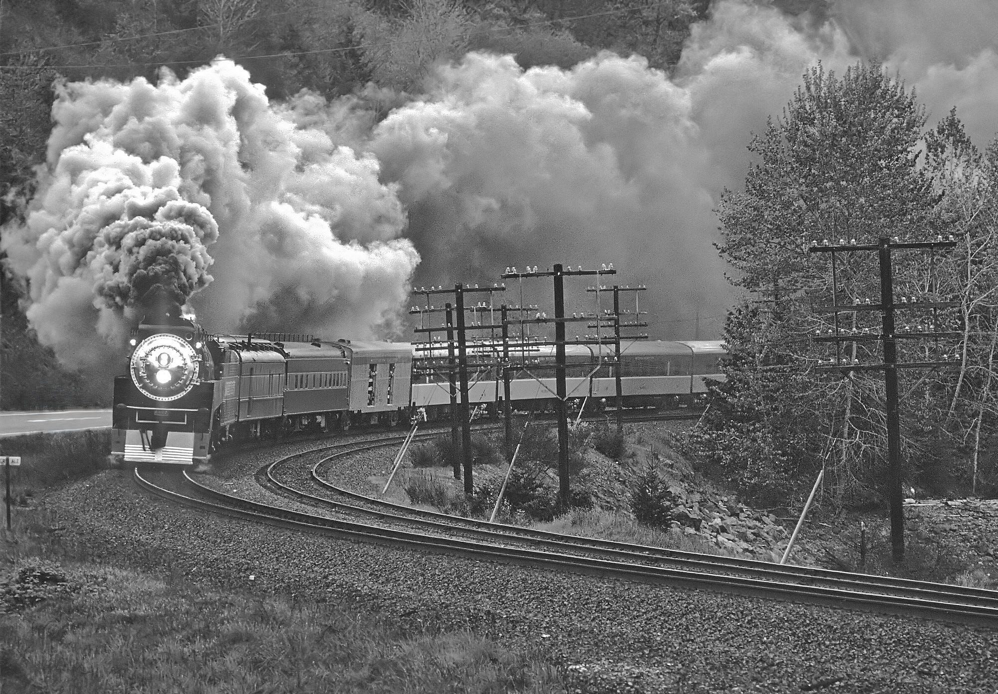 A steam train rounding a bend.