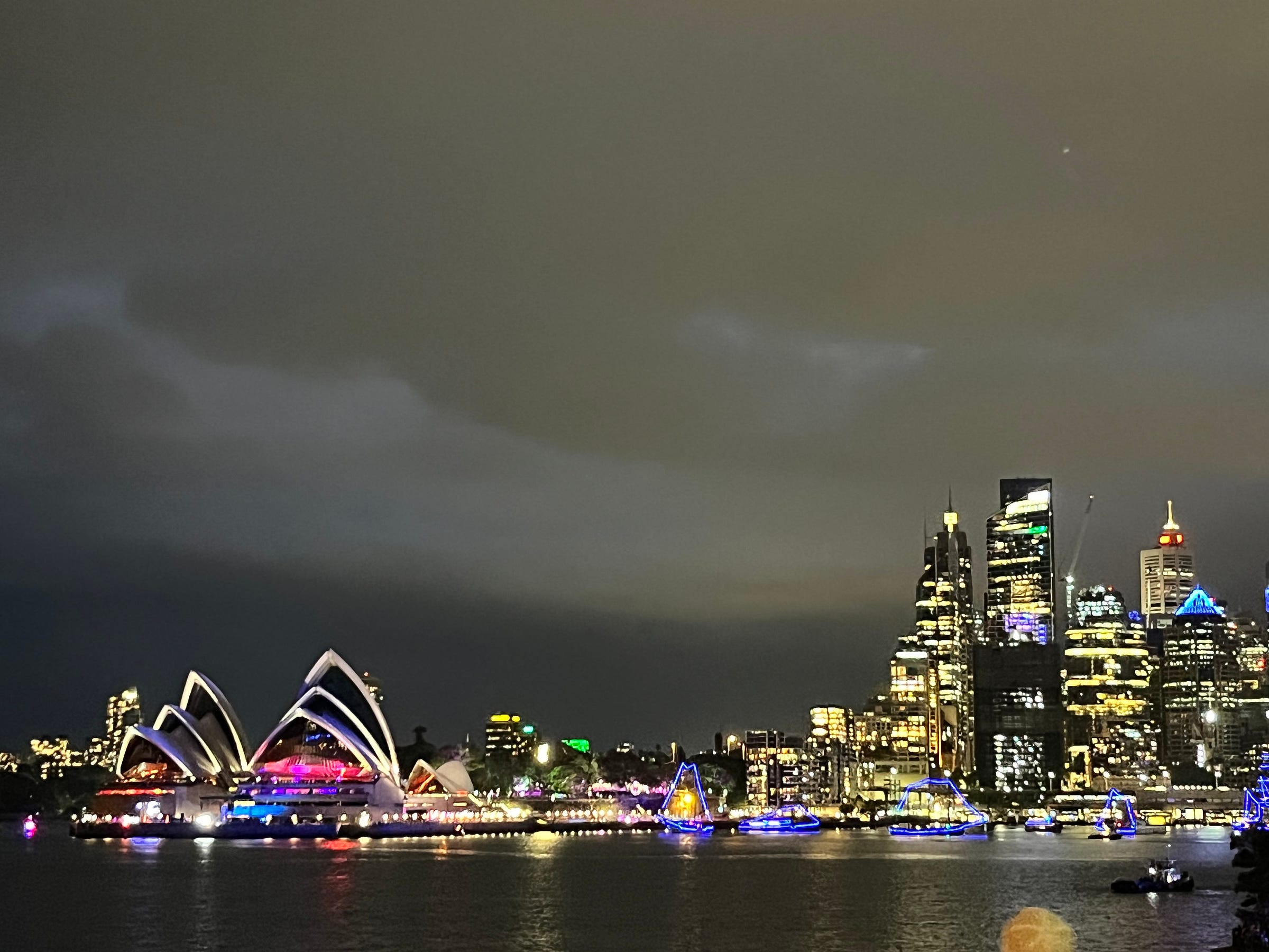 Sydney Opera House and skyline lit at night