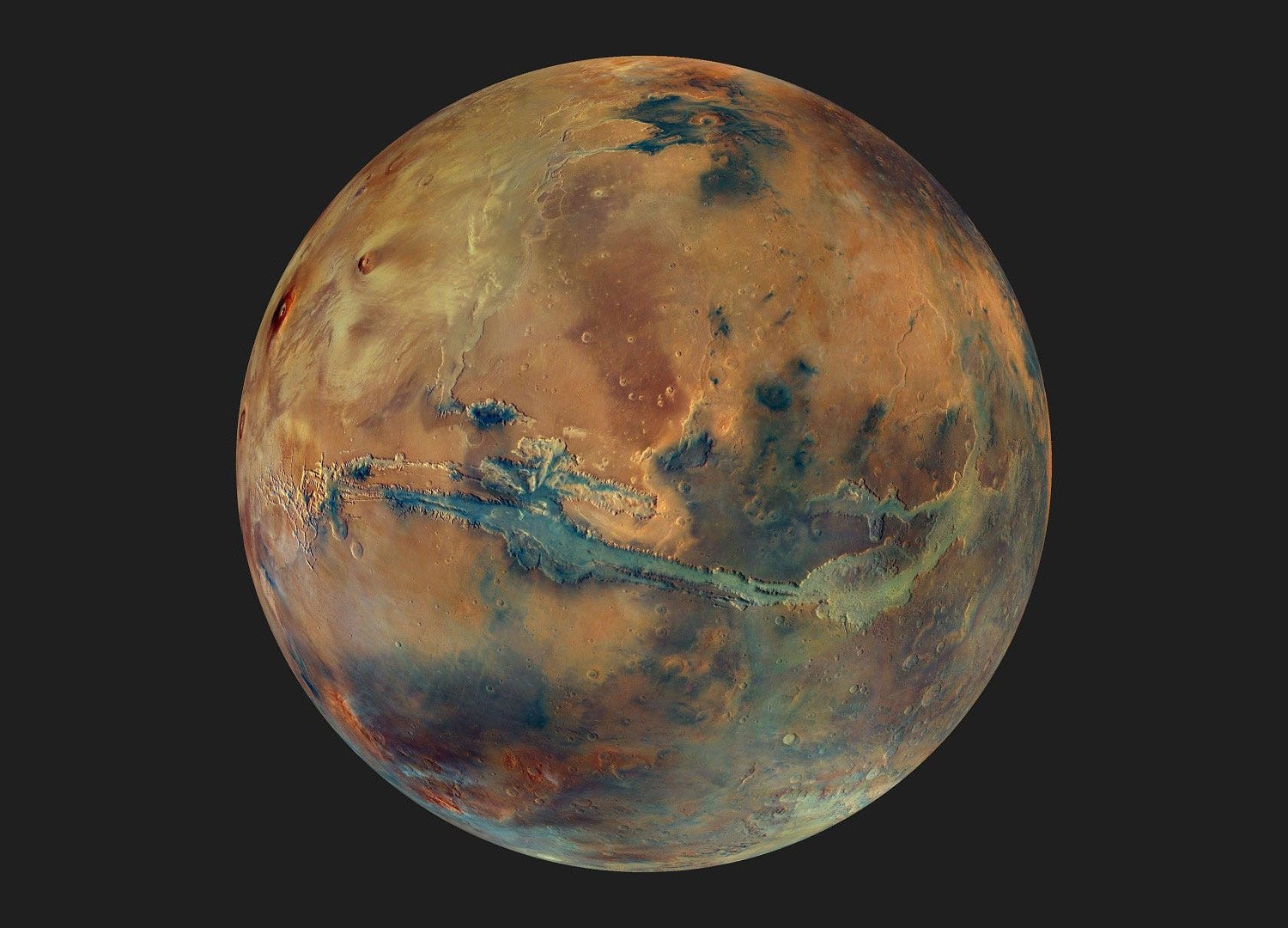 Enhanced-color Mars is more dull orange near the top right, with a darker brown area in the lower right, and a long greenish slash across the middle that is Valles Marineris.
