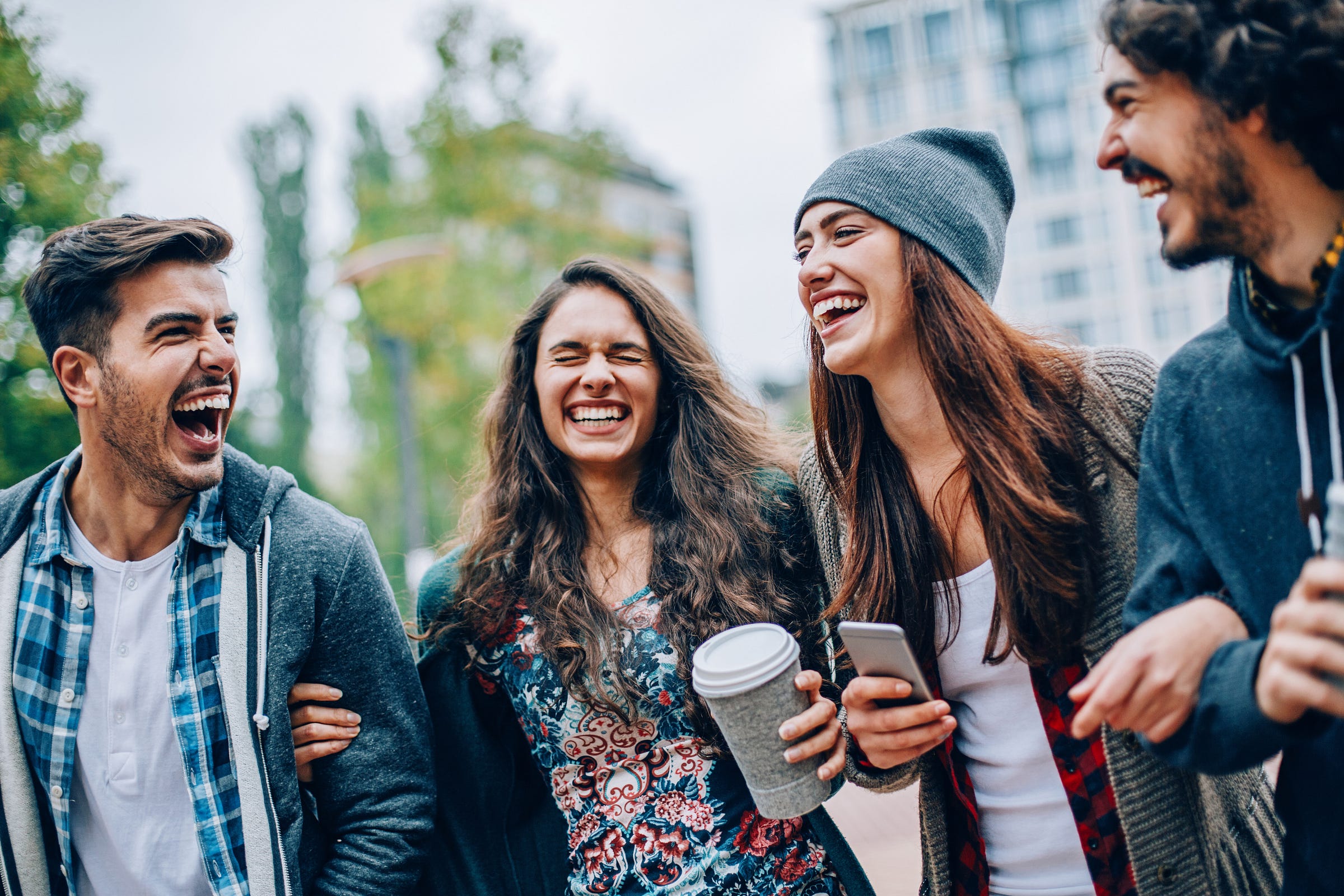 photo of young people laughing