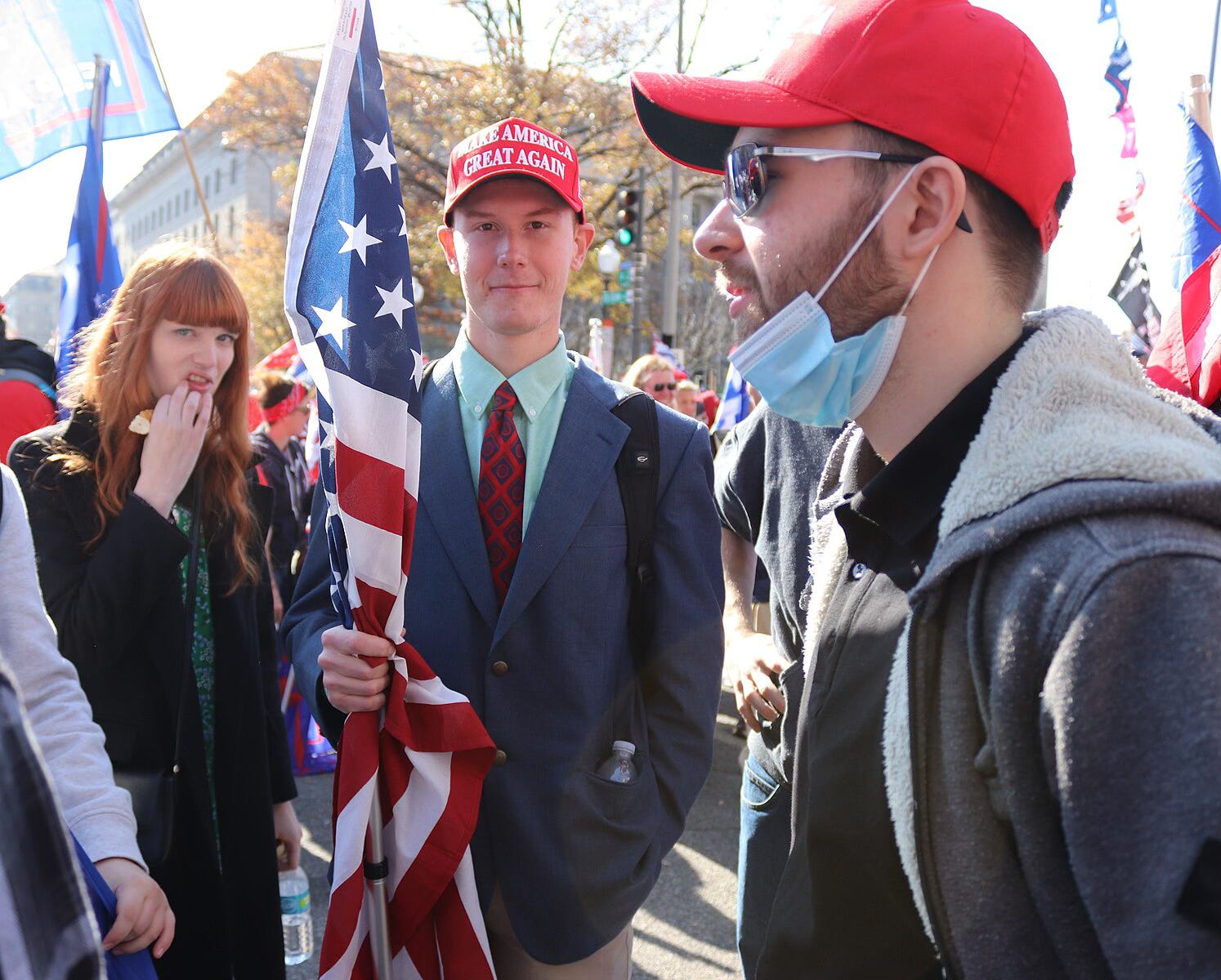 Young men who support Donald Trump dressed in MAGA apparel.