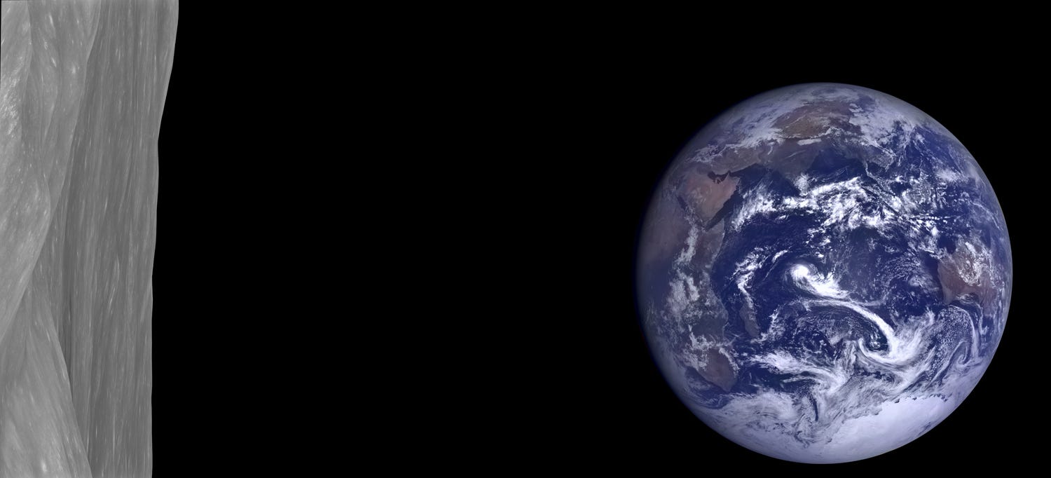 Long rectangular photo showing the nearly full Earth off to the right, blue of ocean and white with clouds, with a lot of black space in the middle, and a bit of the lunar landscape on the left, gray and undulating. 