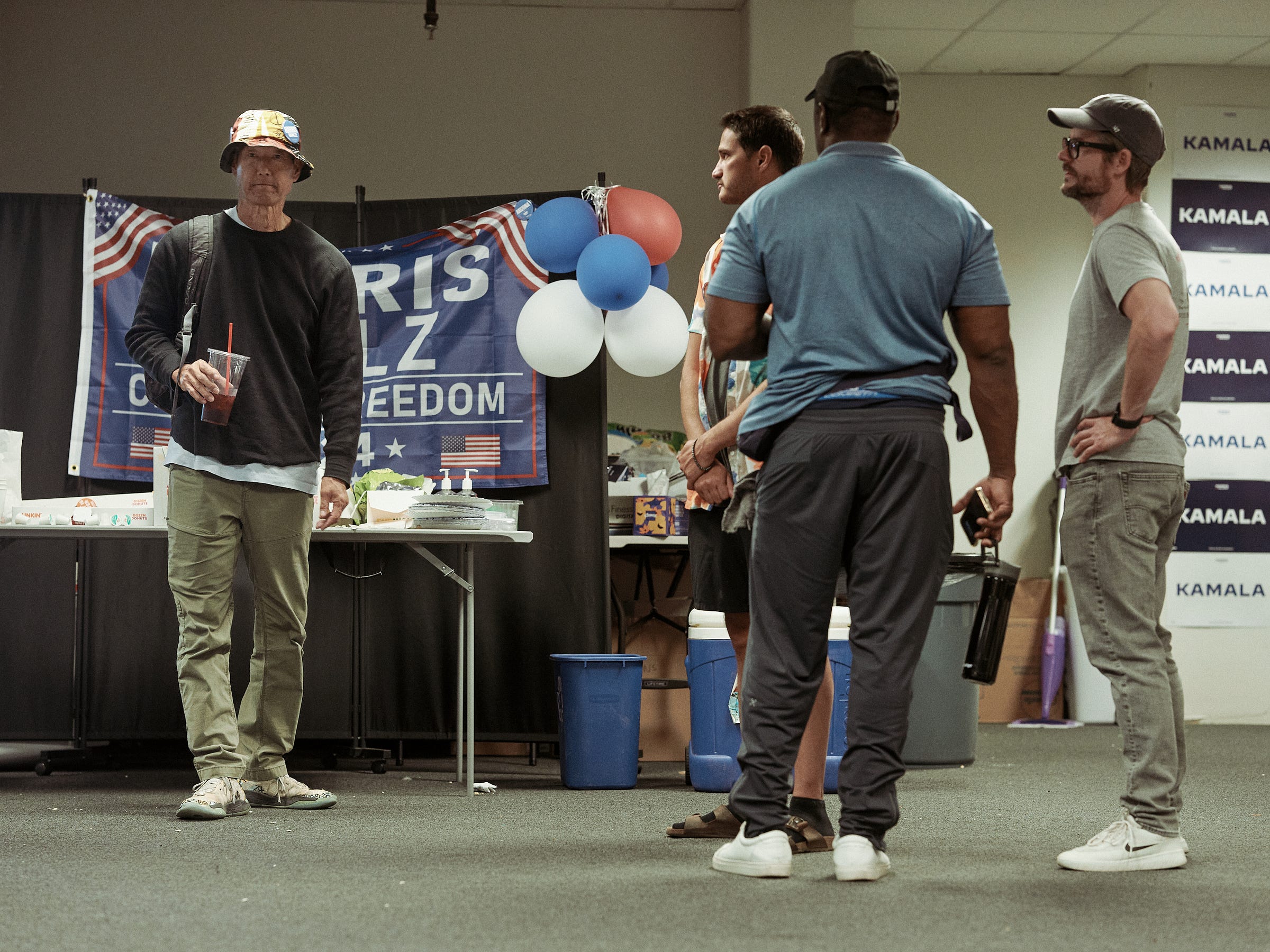 Volunteers gather for some hydration at the Harris Walz campaign office after completing their last shift for the weekend photographed by LA documentary photographer Afonso Salcedo