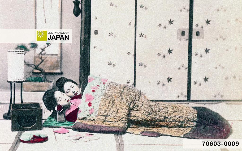 Albumen photo of two Japanese women sleeping next to a hibachi charcoal brazier, 1890s Albumen photo of two Japanese women sleeping next to a hibachi charcoal brazier, 1890s