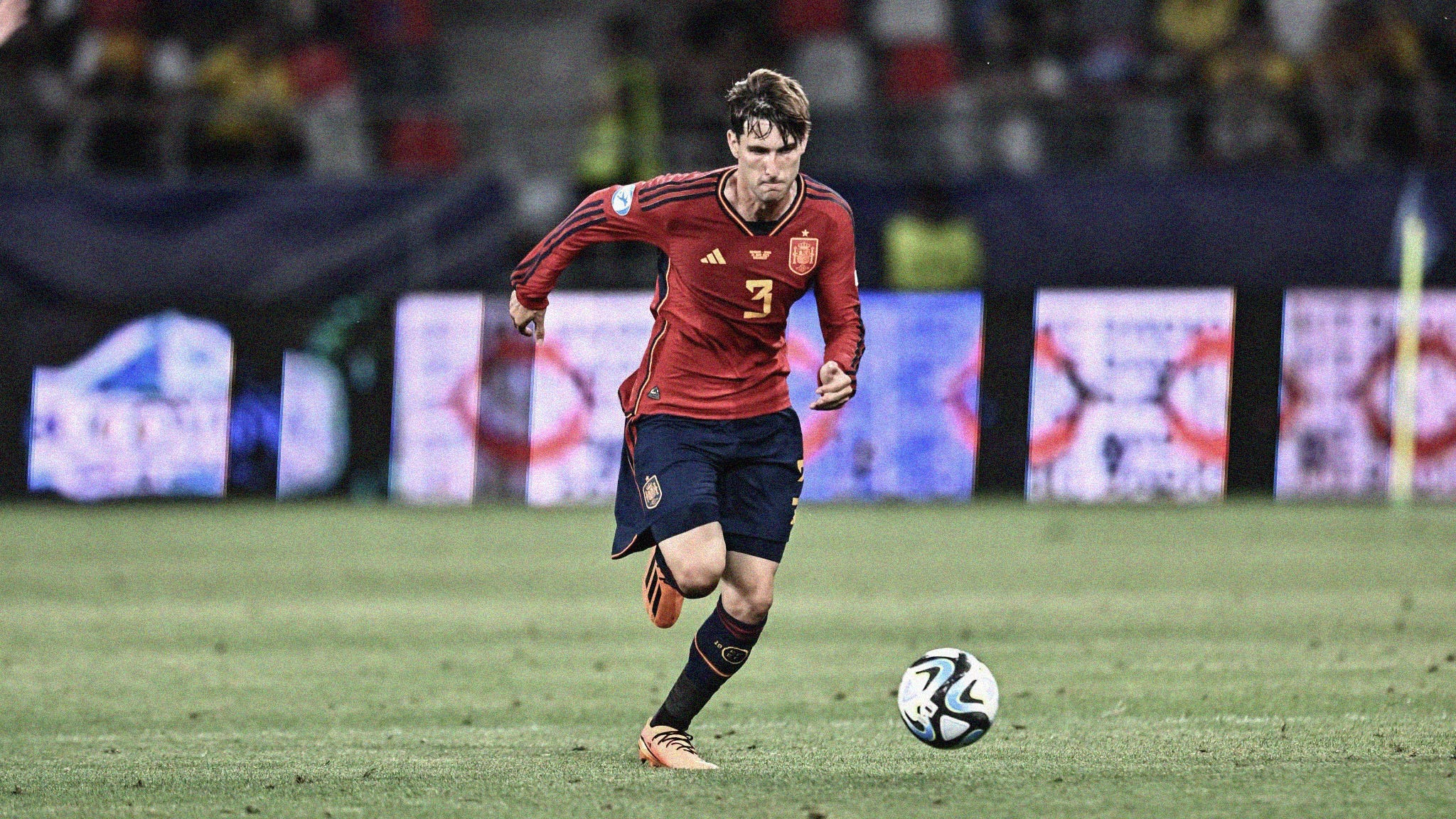A photo of Juan Miranda driving with the ball for Spain at the 2023 UEFA U-21 EURO