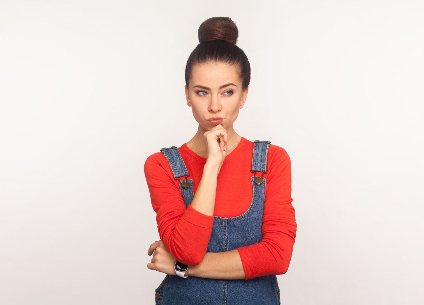 Image of a woman deep in thought. Photo courtesy of Khosro via Canva.