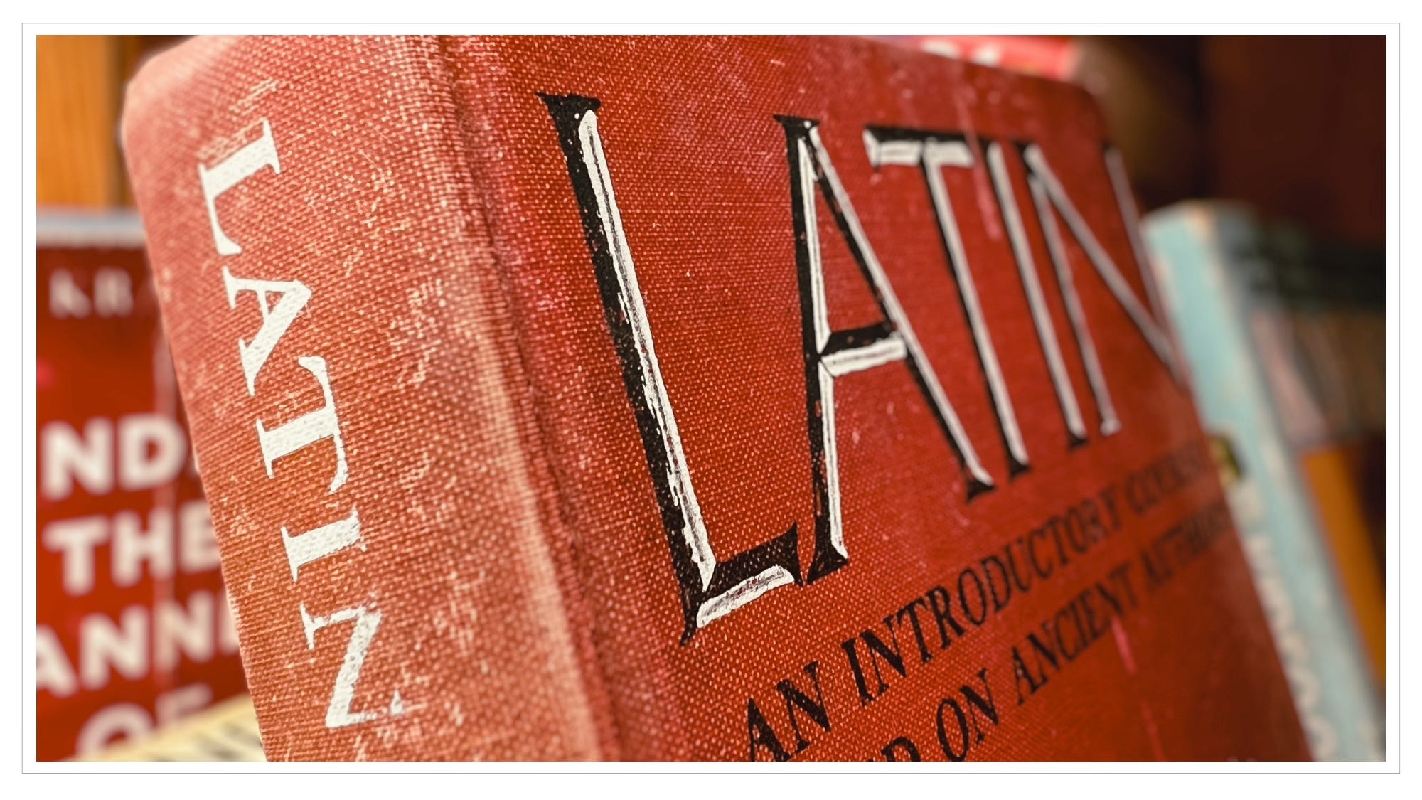 close-up, antique book entitled Latin