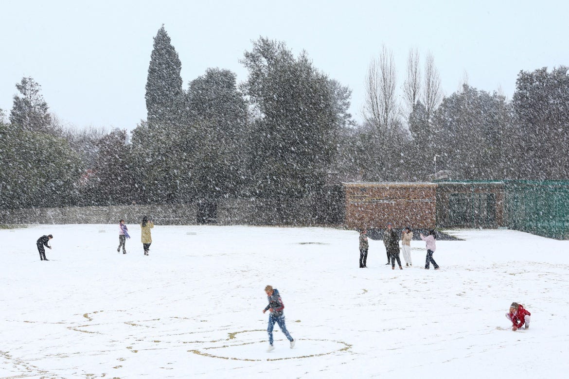 Children play in the snow at Laerskool Orion