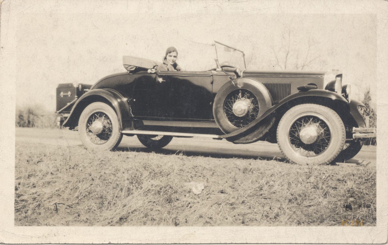 Dorothy Harger, born in 1908, behind the wheel in a roadster circa 1931.